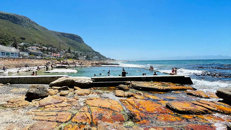 Muizenberg Beach with its gentle swells is one of Foster's top recs for a sublime surfing experience off Cape Town's coast