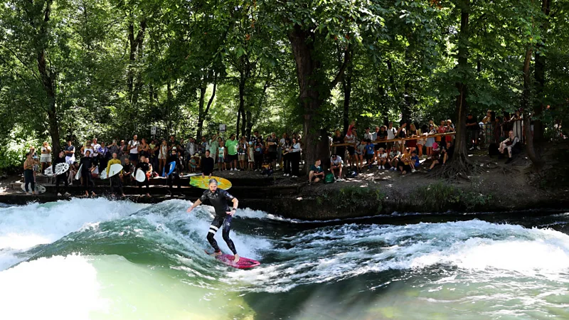 Take a surf break in the middle of the city at Munich's Englischer Garten 